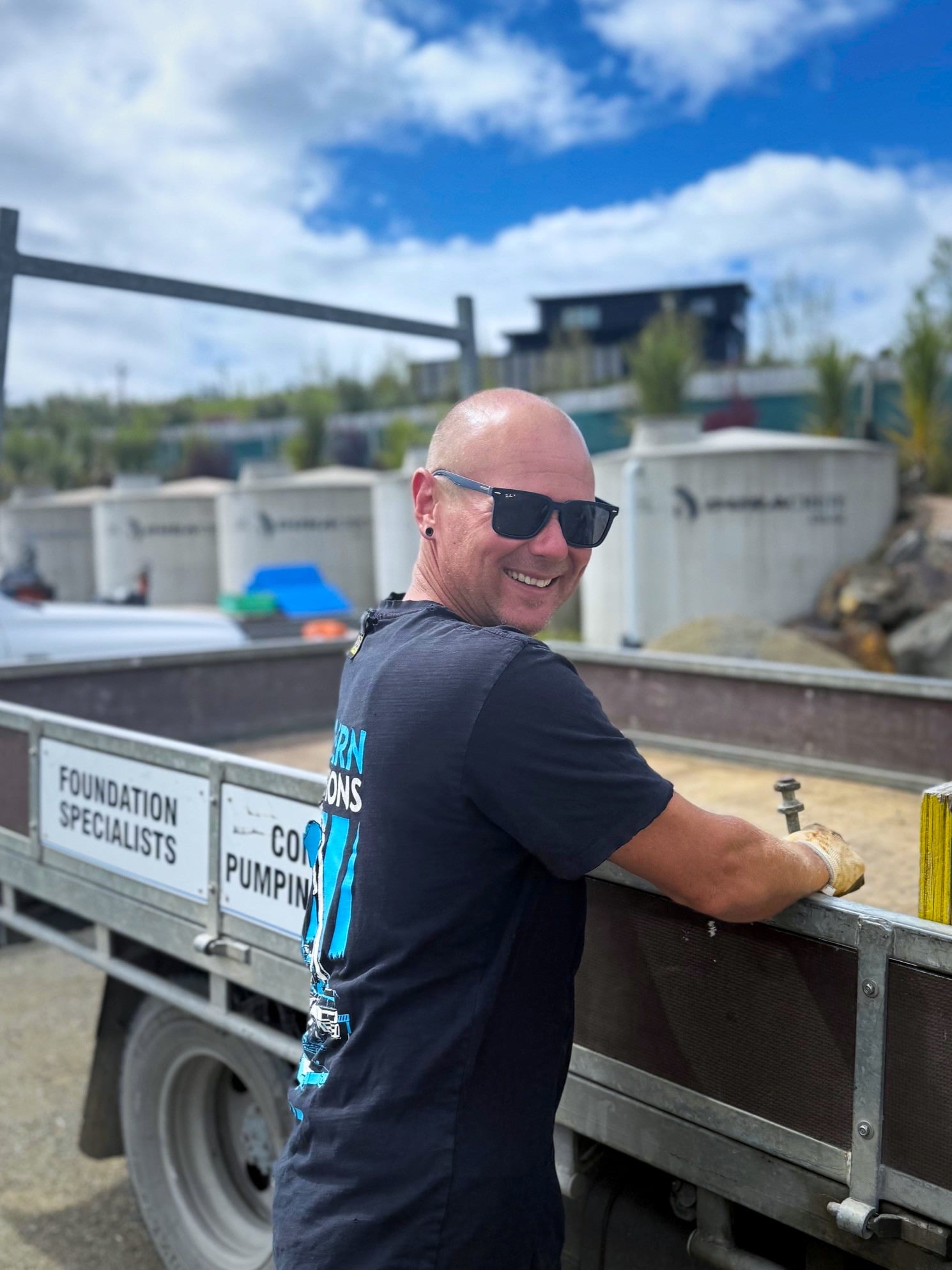 Jeremy Wakelin beside a Northern Foundations truck on site