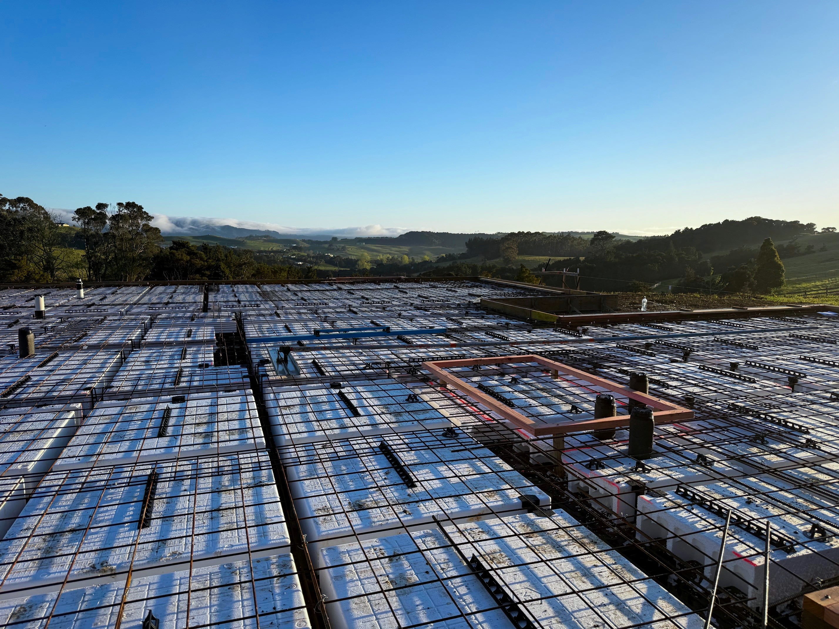 A pod floor set out with steel, ready for the pour