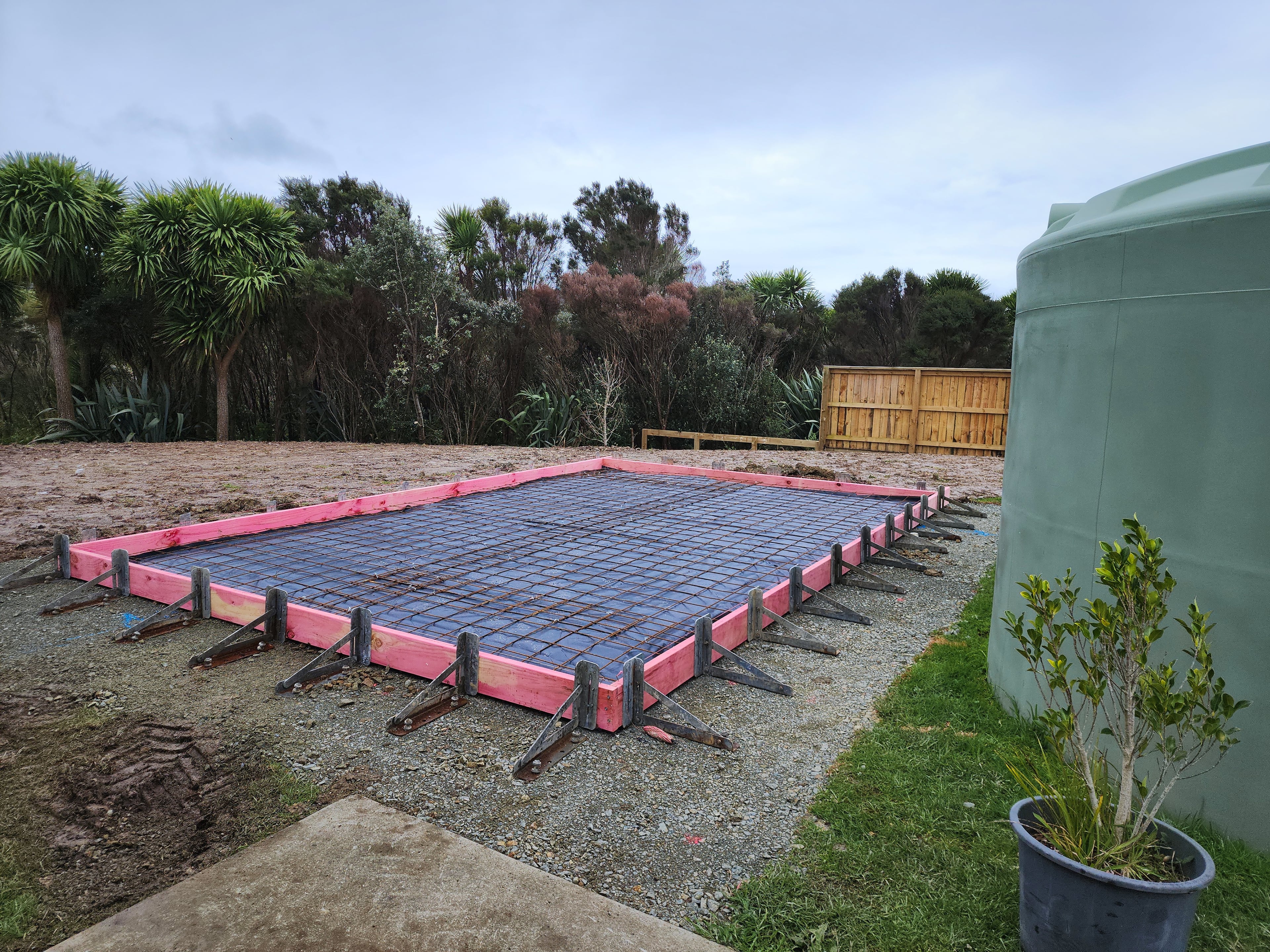Rib raft boxing and steel in place beside a water tank