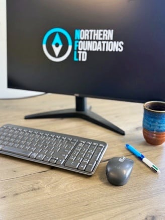 The Northern Foundations logo on an office computer screen